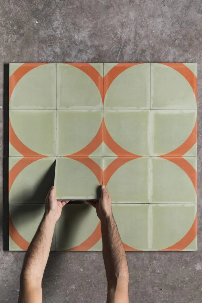 Composizione di cementine Sansone nei toni del verde e dell’arancio