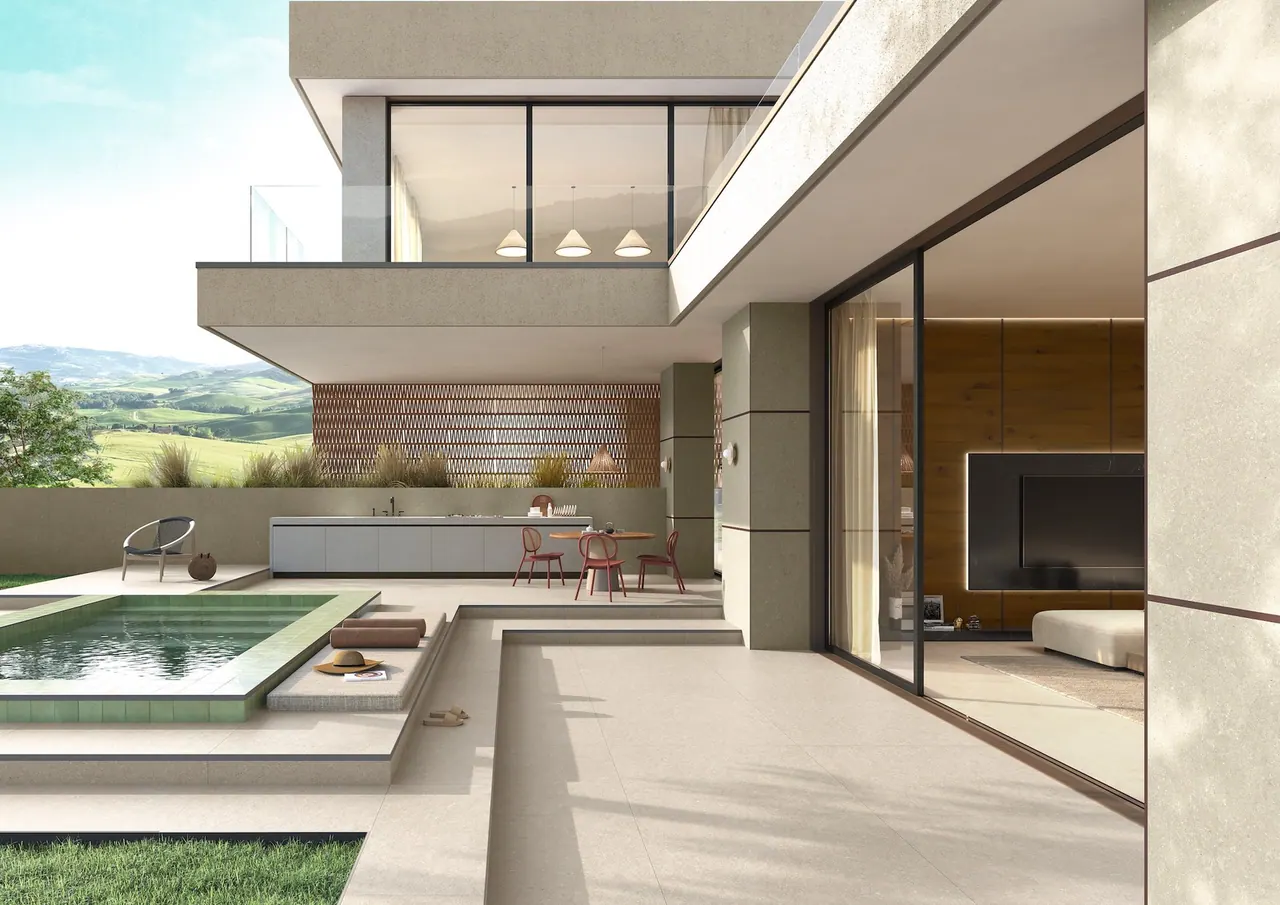 Ambientazione Kaleidos con terrazzo chiaro, piscina e grandi aperture verso il soggiorno